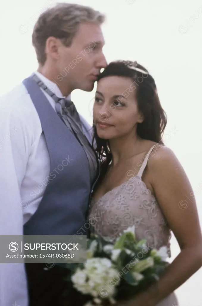 Side profile of a young couple embracing