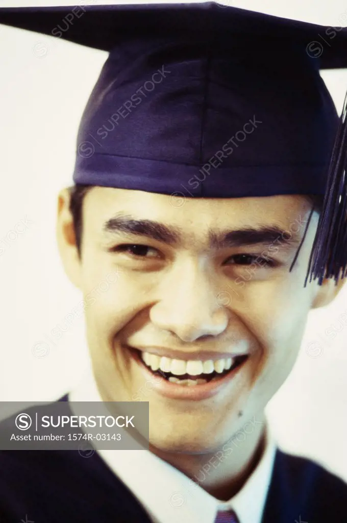 Close-up of a young male graduate smiling