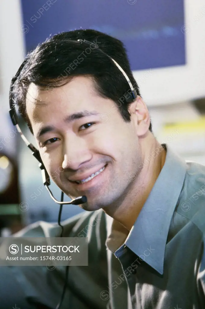 Portrait of a businessman wearing a headset smiling