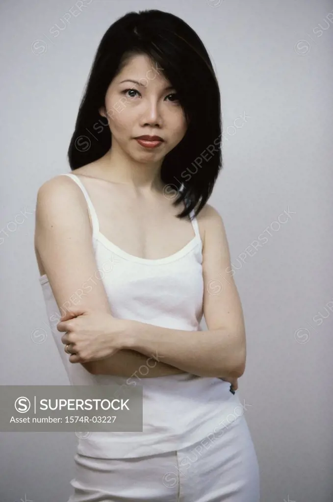 Portrait of a mid adult woman standing with her arms folded