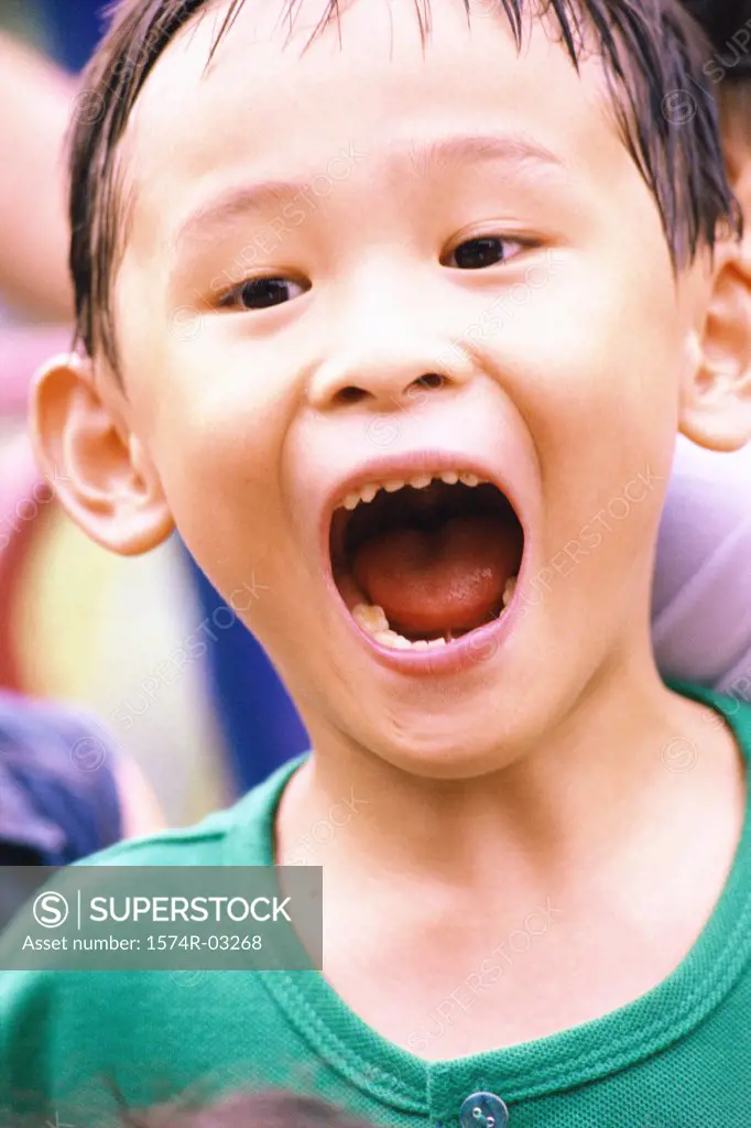 Close-up of a boy with his mouth open