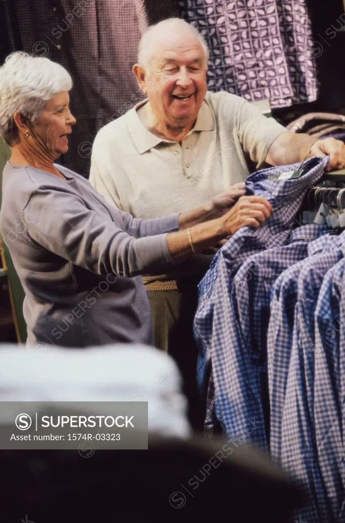 Senior couple choosing a shirt in a clothing store