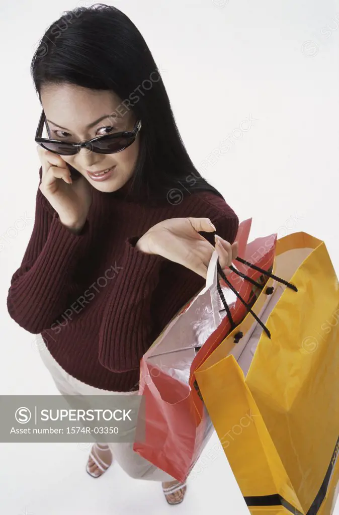 High angle view of a young woman carrying shopping bags