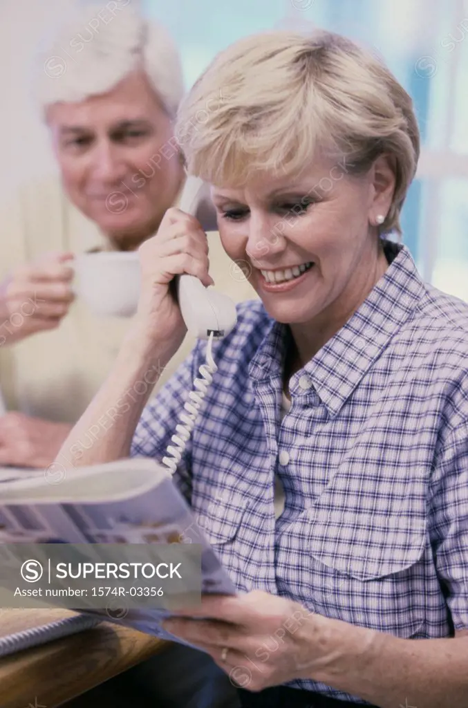 Senior woman talking on a telephone
