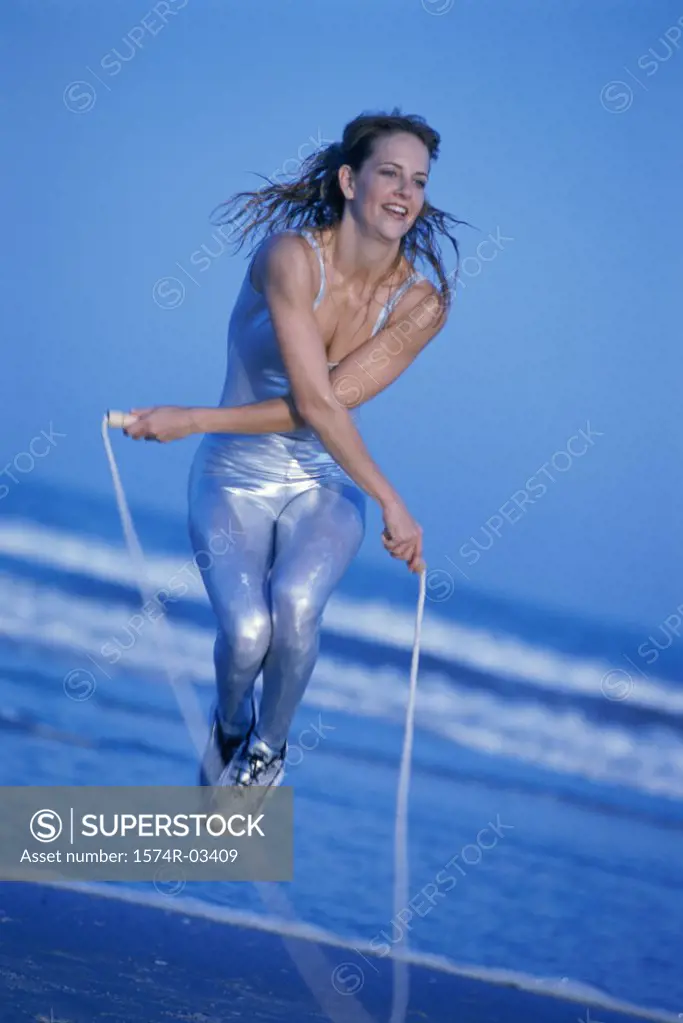 Young woman exercising with a jump rope