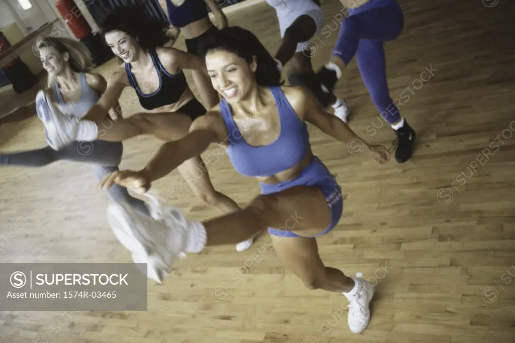 High angle view of a group of young women exercising in an aerobics class