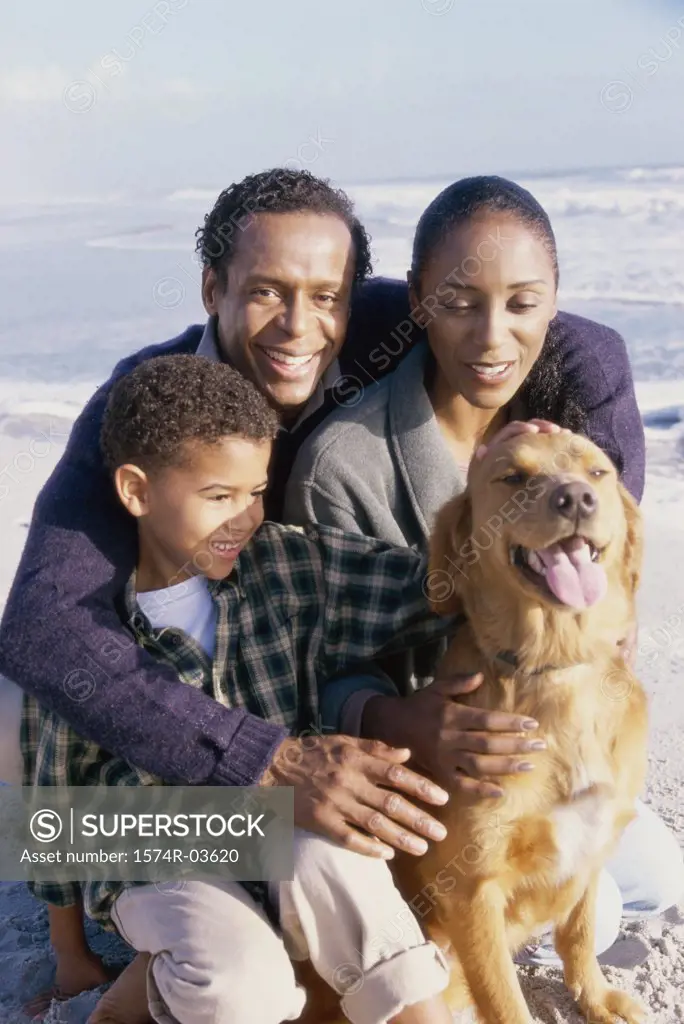 Parents with their son holding a dog