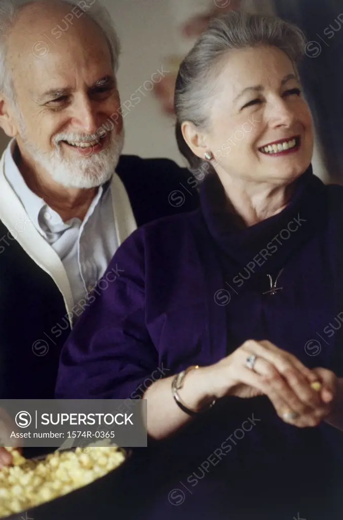 Senior couple standing together smiling
