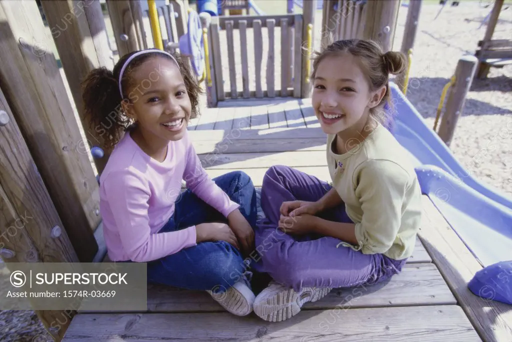 Portrait of two girls sitting