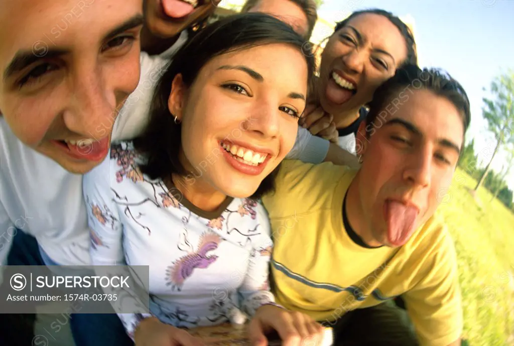 Portrait of a group of teenagers making faces