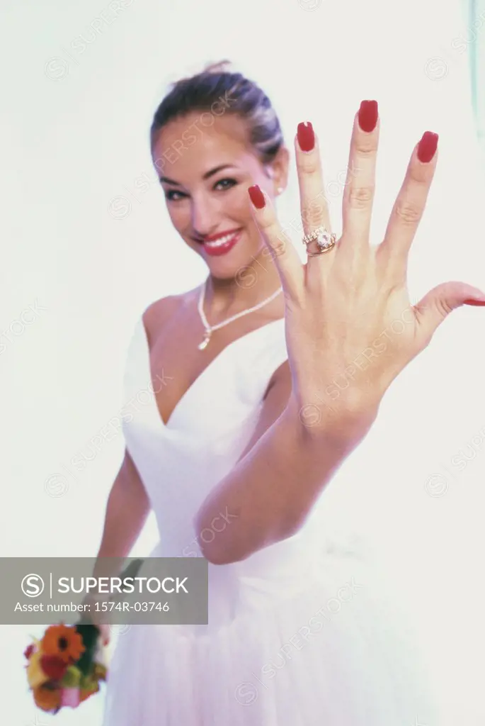 Portrait of a bride showing her wedding ring