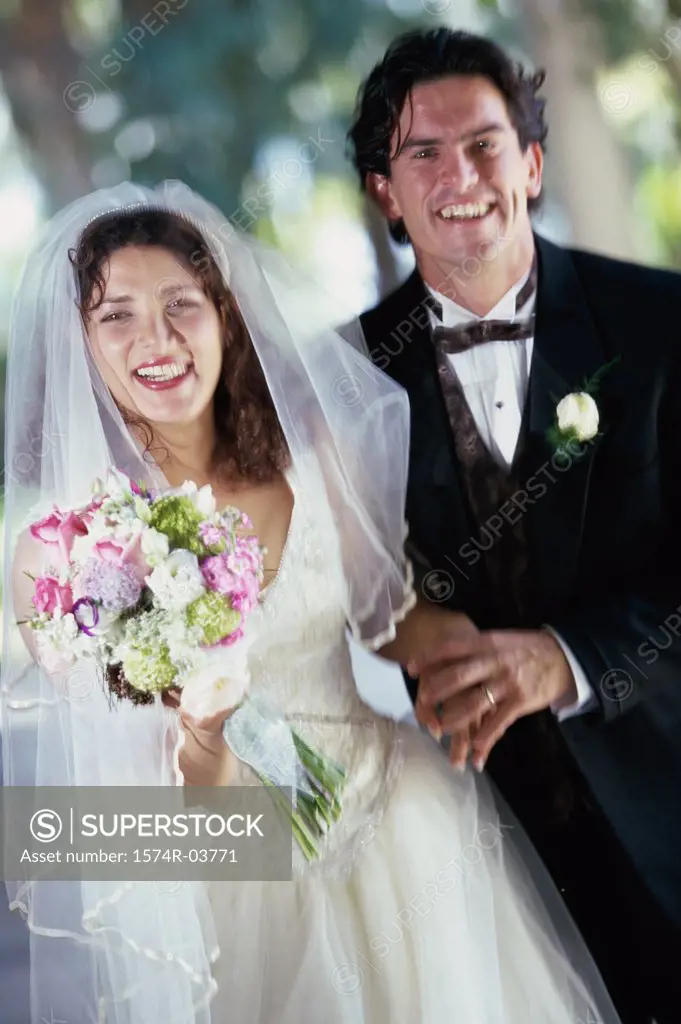 Portrait of a newlywed couple smiling