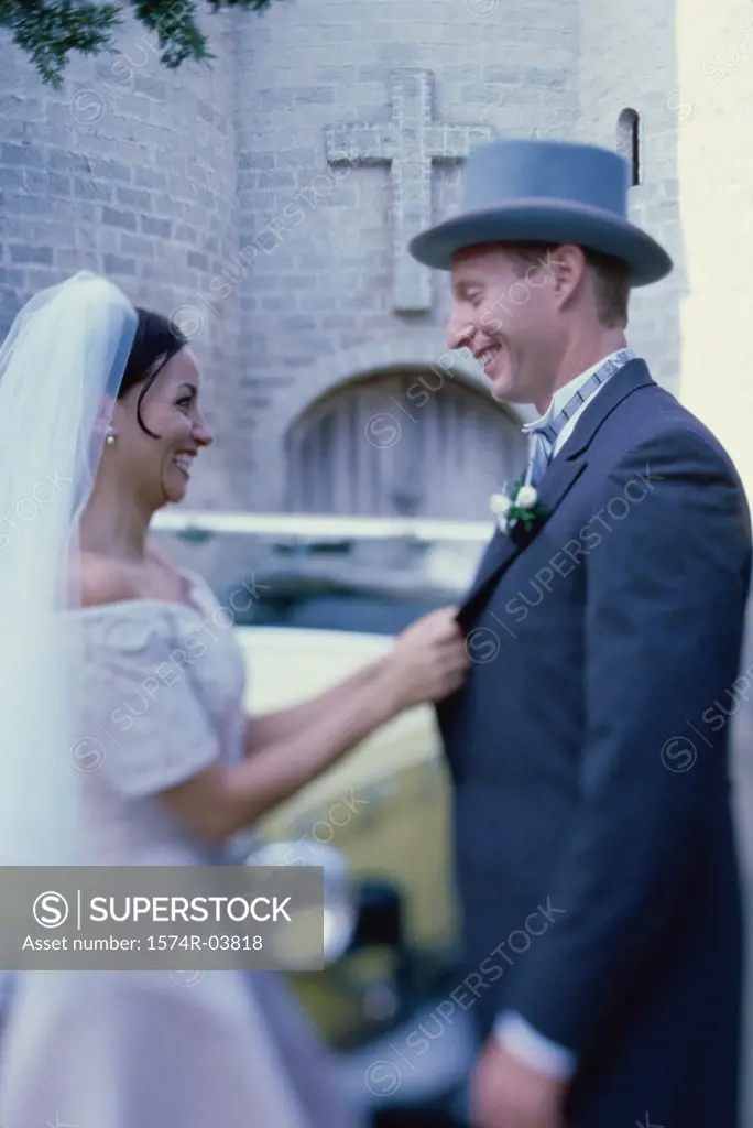 Side profile of a newlywed couple smiling