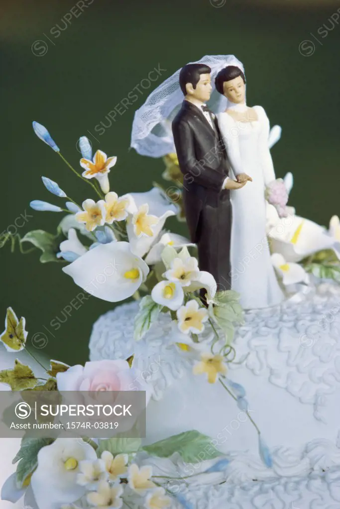 Figures of a bride and groom on a wedding cake