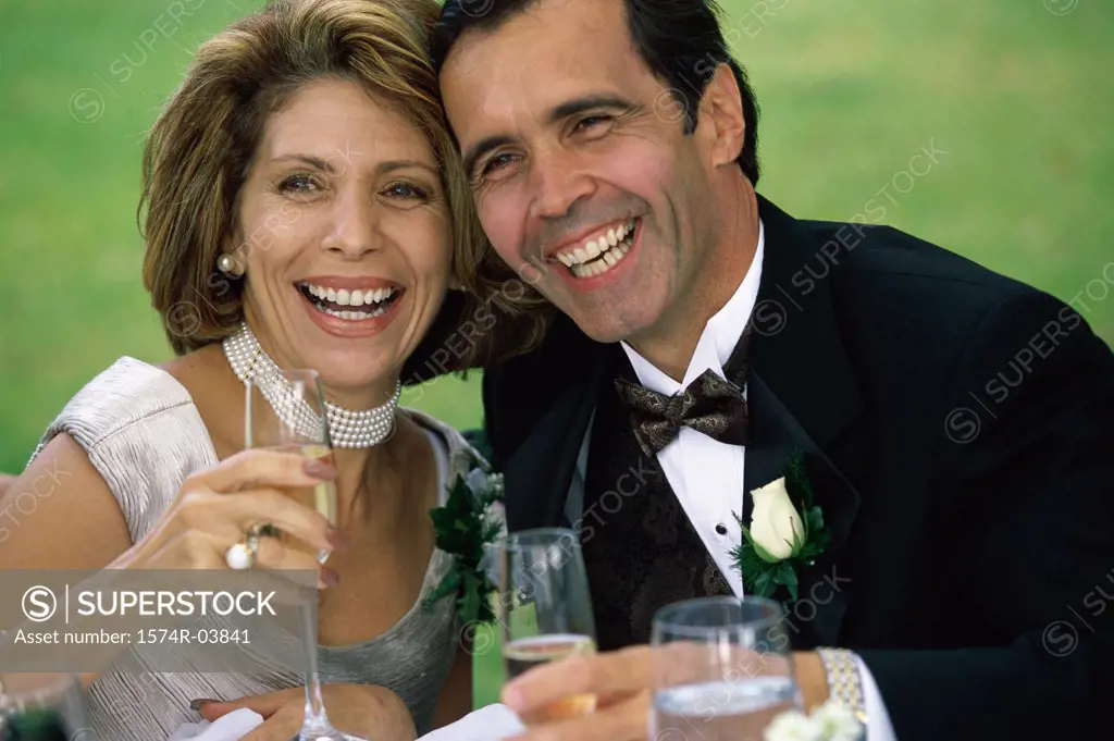 Close-up of a newlywed couple drinking champagne