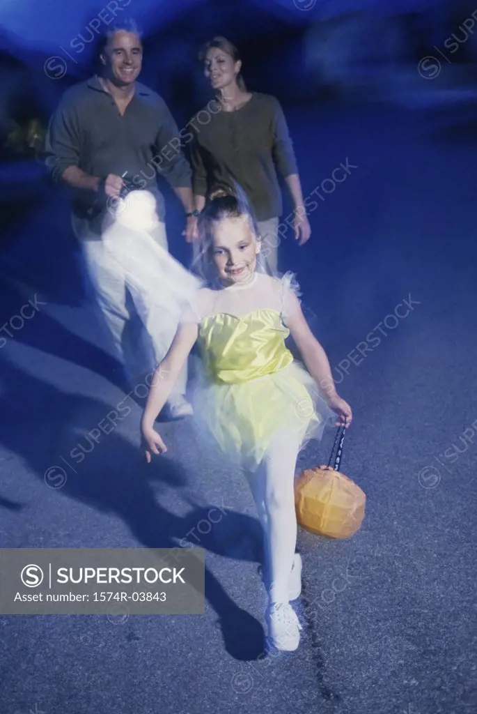 Girl trick or treating at Halloween