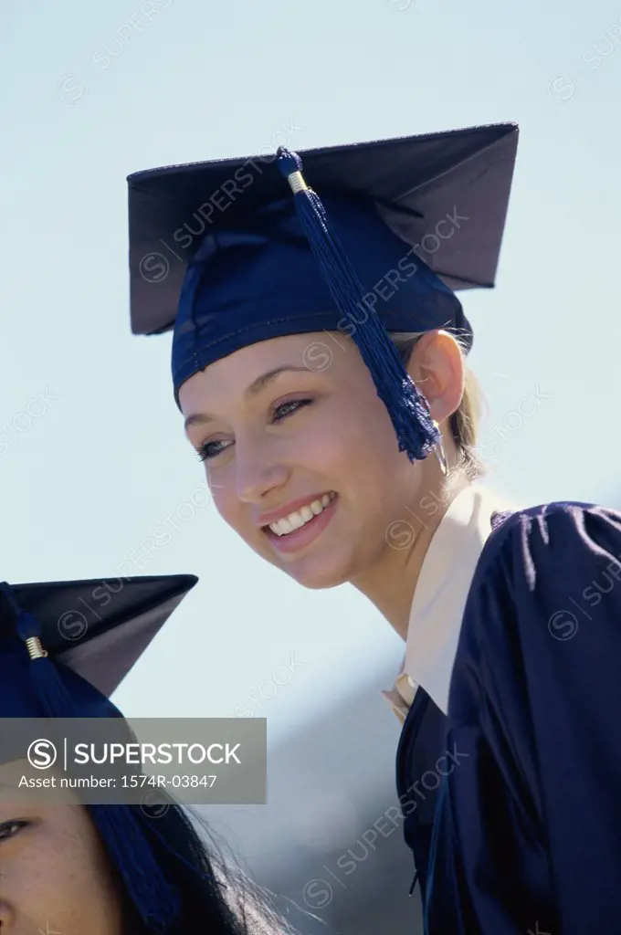 Young female graduate smiling