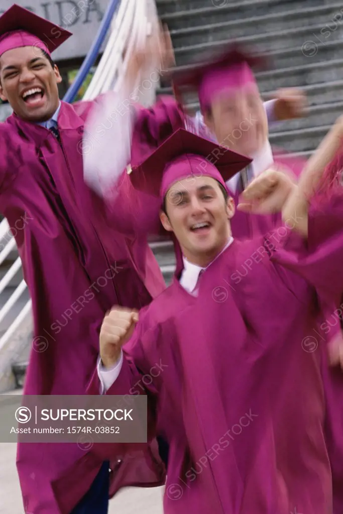 Group of college students wearing graduation outfits