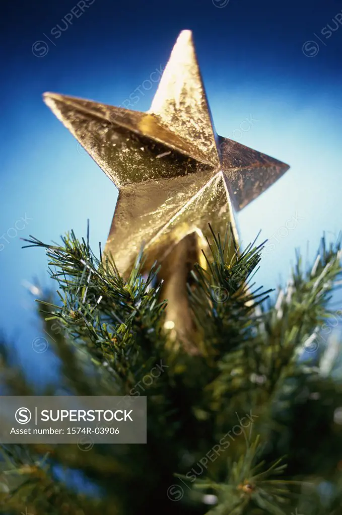 Close-up of a Christmas star on top of Christmas tree