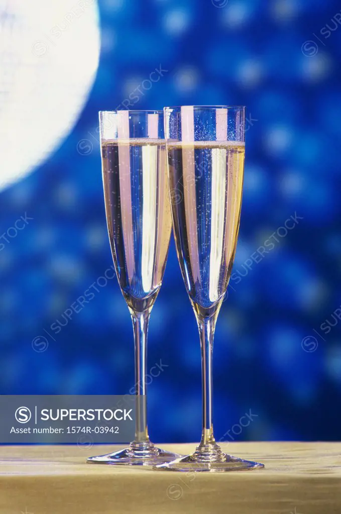 Close-up of two champagne flutes on a table