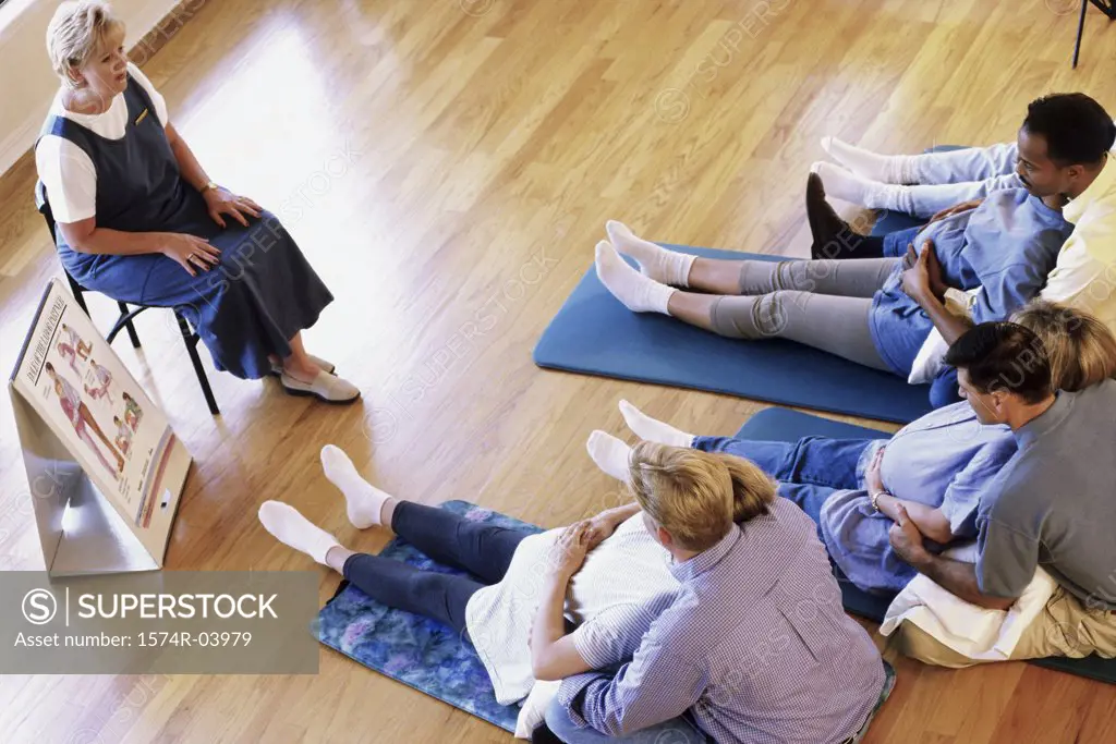 Husbands and their pregnant wives at a prenatal class