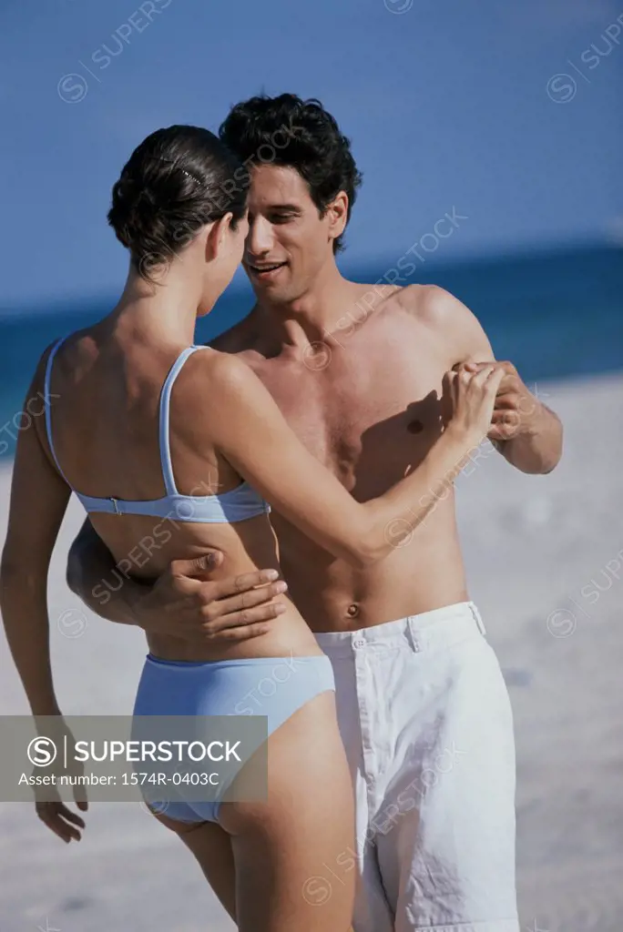 Young couple dancing on the beach