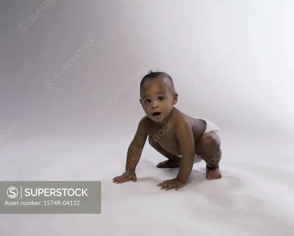 Portrait of a baby boy crawling