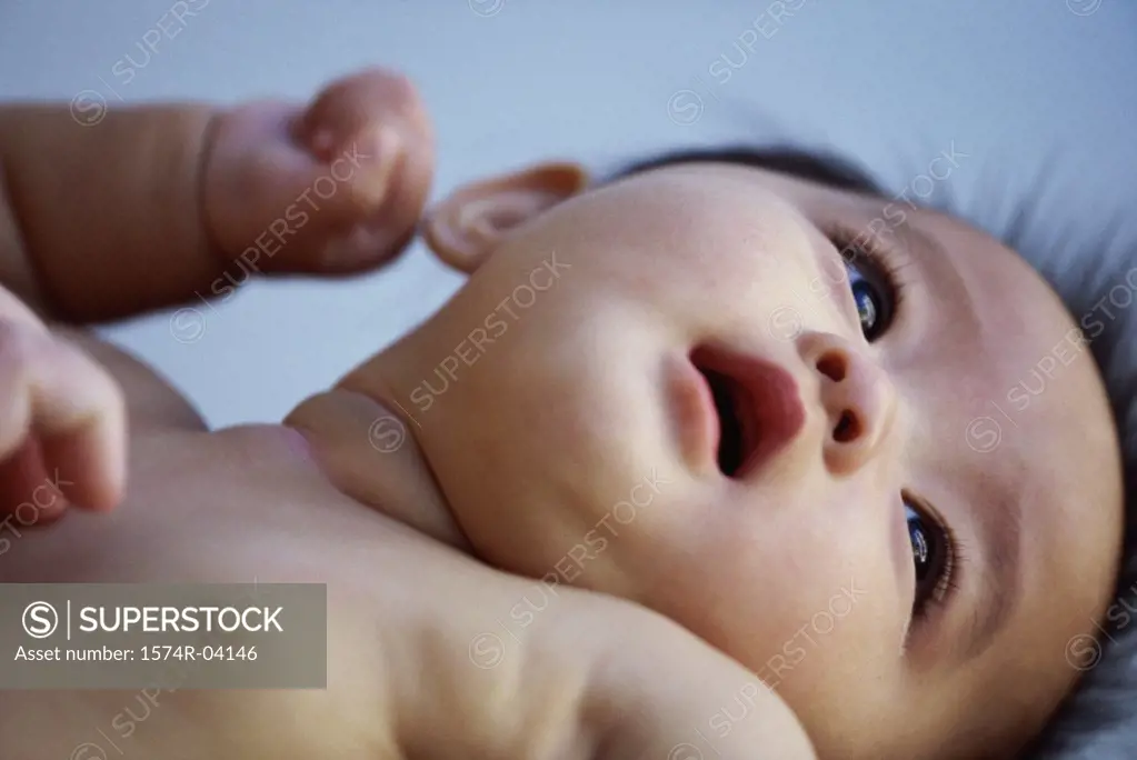 Close-up of a baby boy lying down