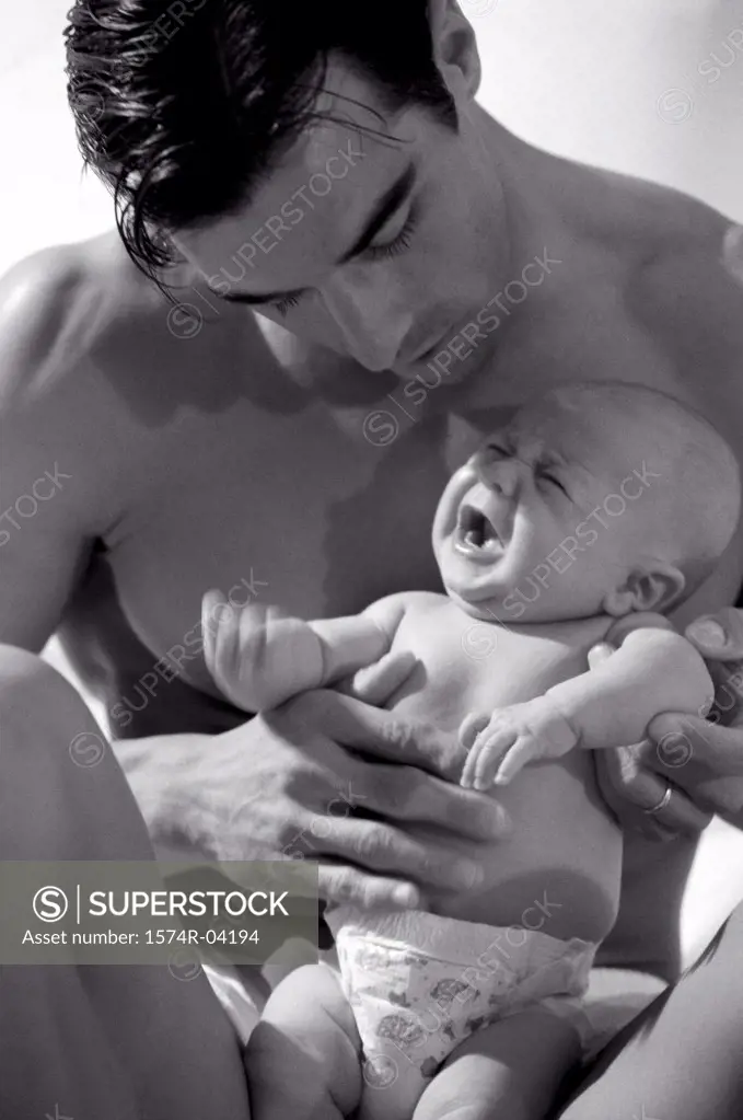 Close-up of a father holding his baby boy