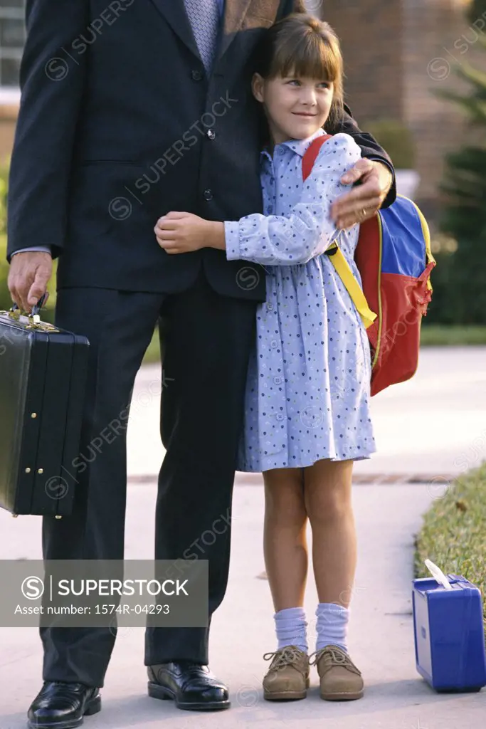 Father standing with his daughter
