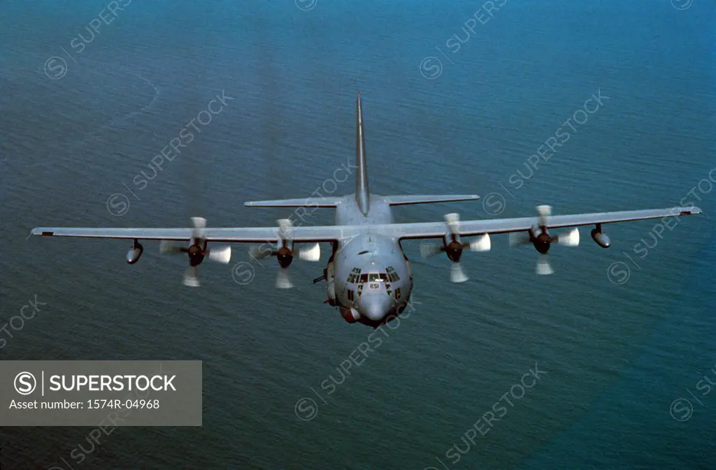 Aerial view of an AC-130H flying over the sea
