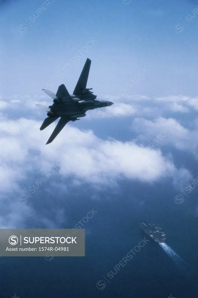 F-14A Tomcat fighter jet flying over USS John F.Kennedy