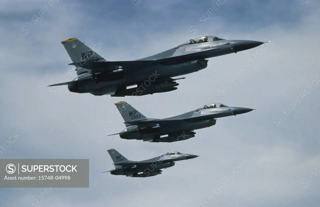 Low angle view of three F-16 Fighting Falcons flying in formation