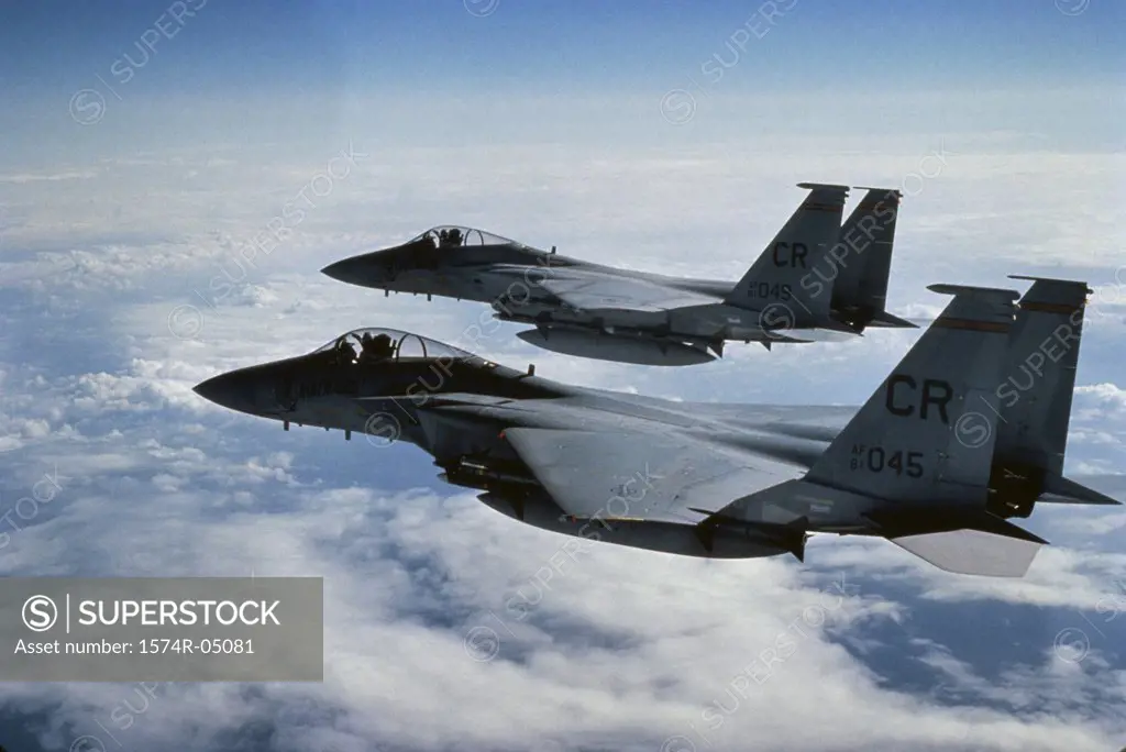 Two F-15 Eagle jet fighters in flight