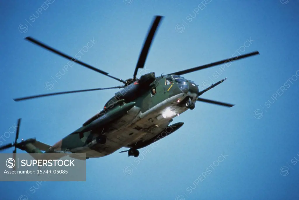 Low angle view of a MH-53H Pave Low military helicopter in flight