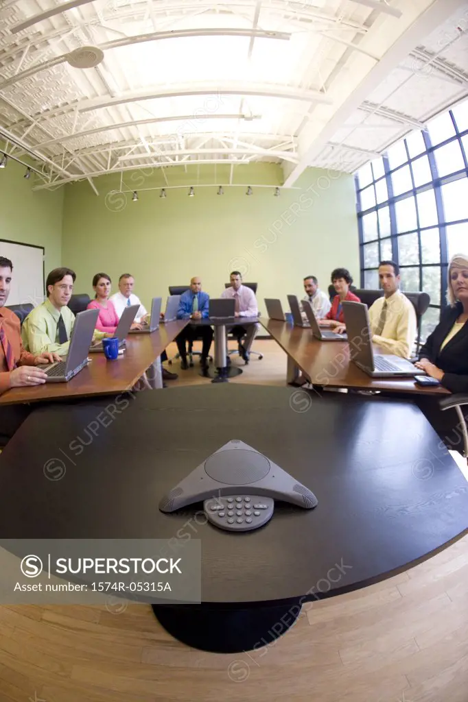 Portrait of a group of business executives sitting in a conference room