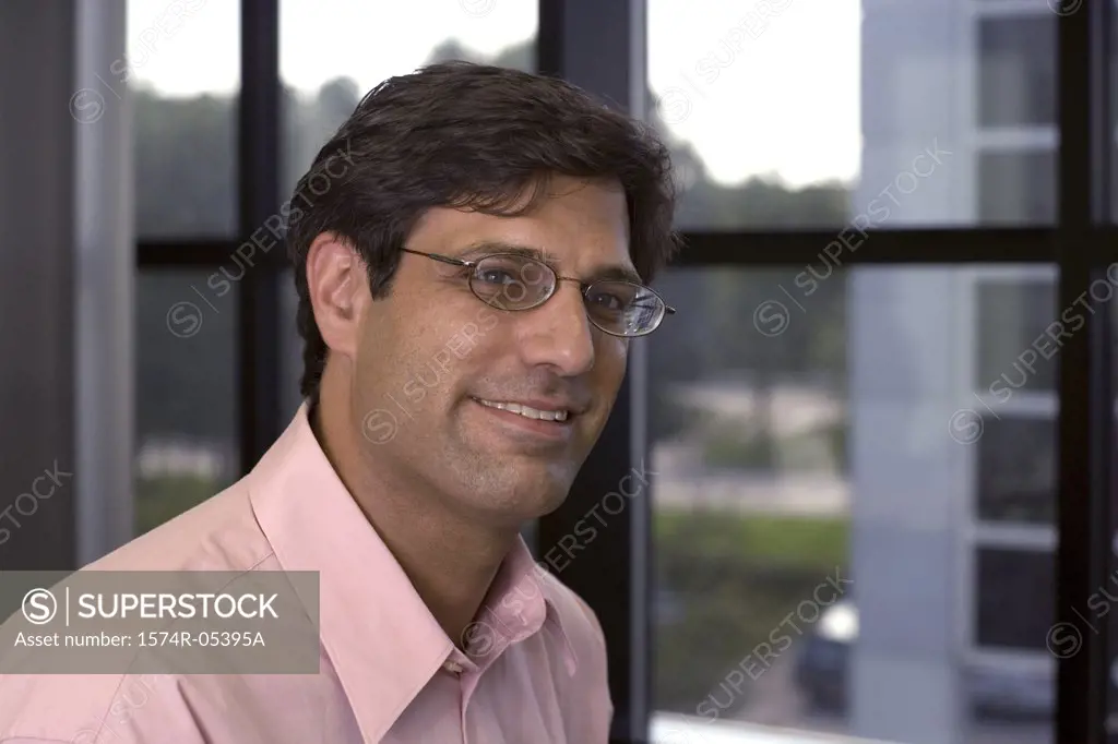 Close-up of a businessman smiling in an office