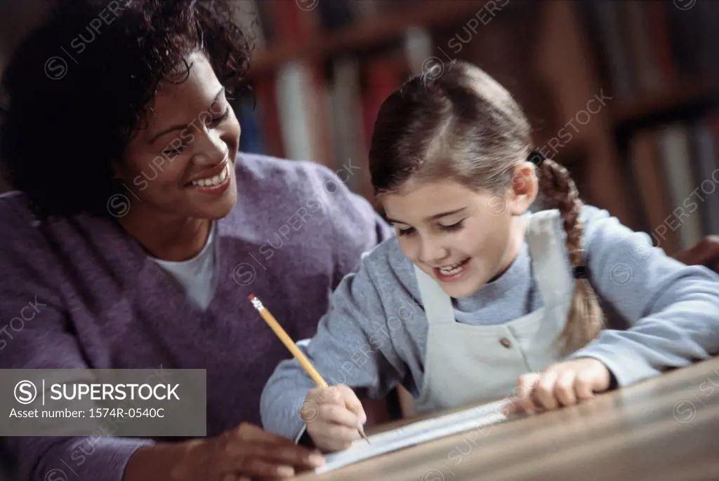 Woman assisting an elementary student