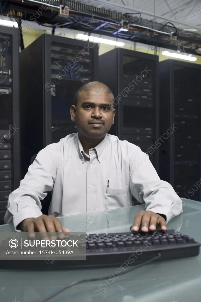 Portrait of a technician working on a network server