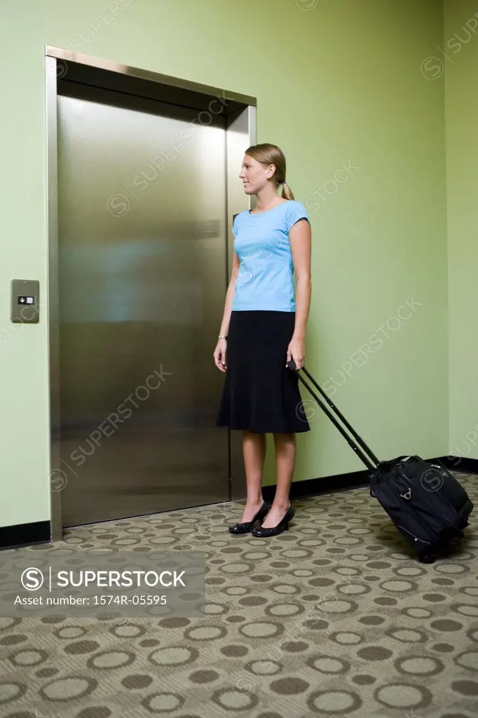 Businesswoman waiting for an elevator