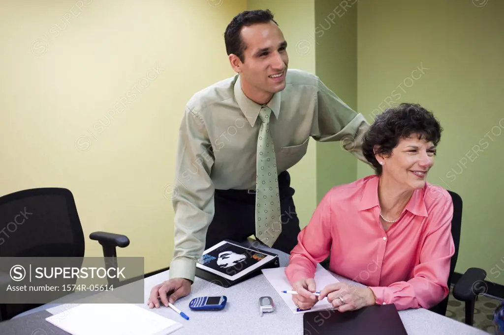 Businessman and a businesswoman in a conference