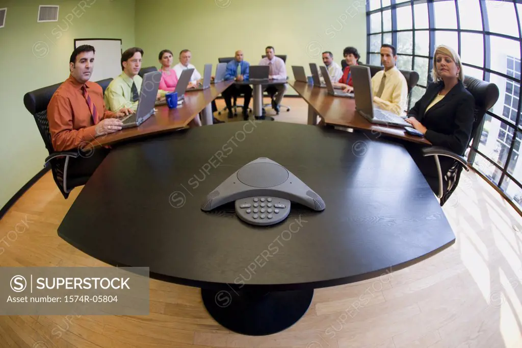 Portrait of a group of business executives sitting in a conference room
