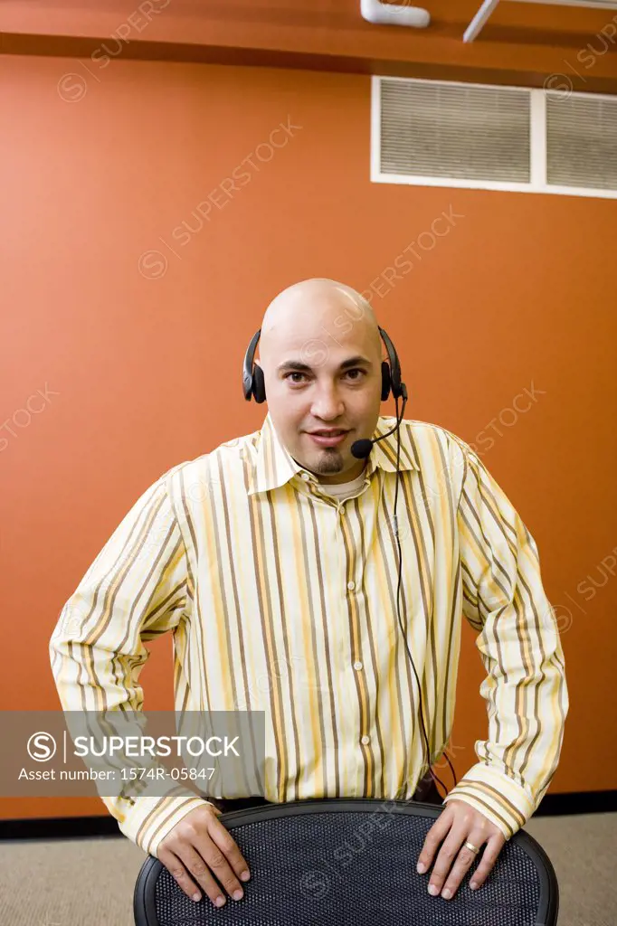 Portrait of a male customer service representative wearing a headset