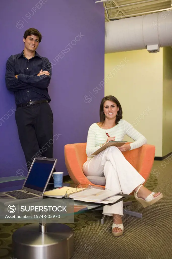 Portrait of a businessman and a businesswoman smiling