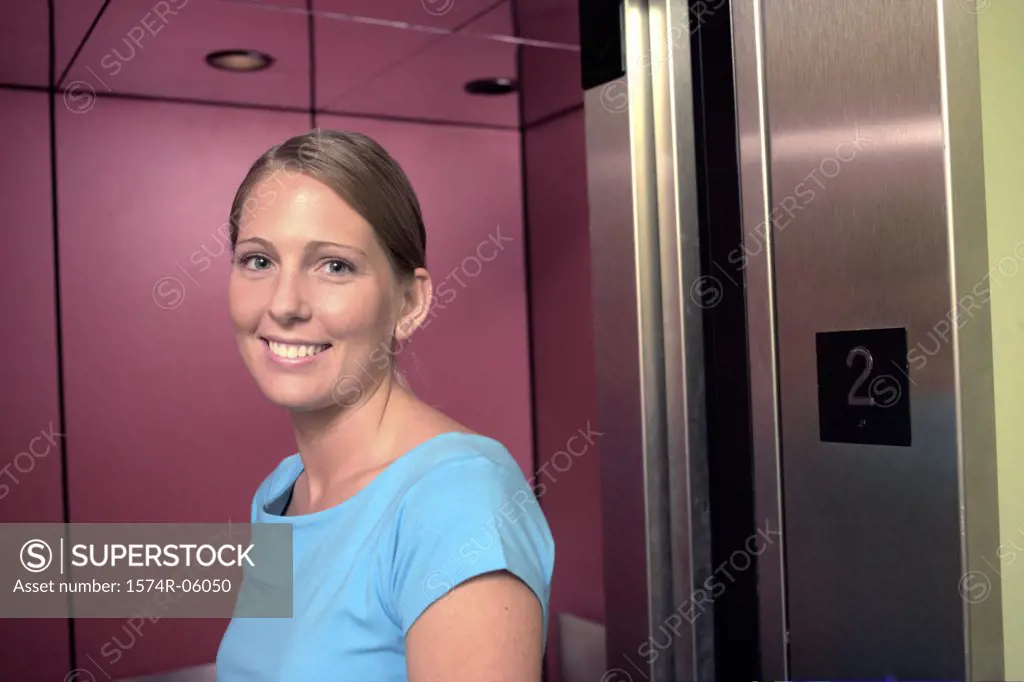 Portrait of a businesswoman standing near an elevator