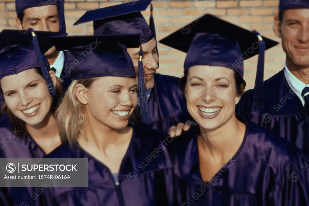 Portrait of a group of students wearing graduation outfits