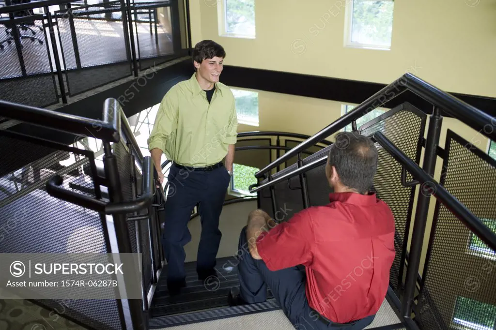 High angle view of two businessmen on a staircase
