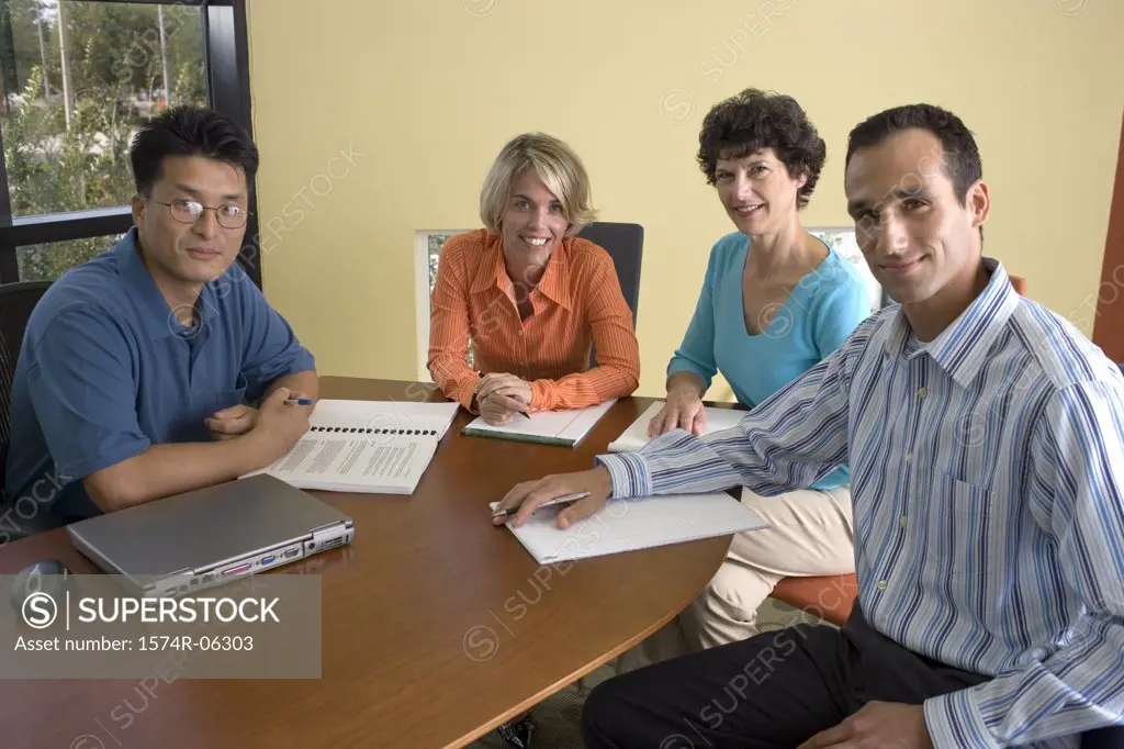 Portrait of two businesswomen and two businessmen in an office