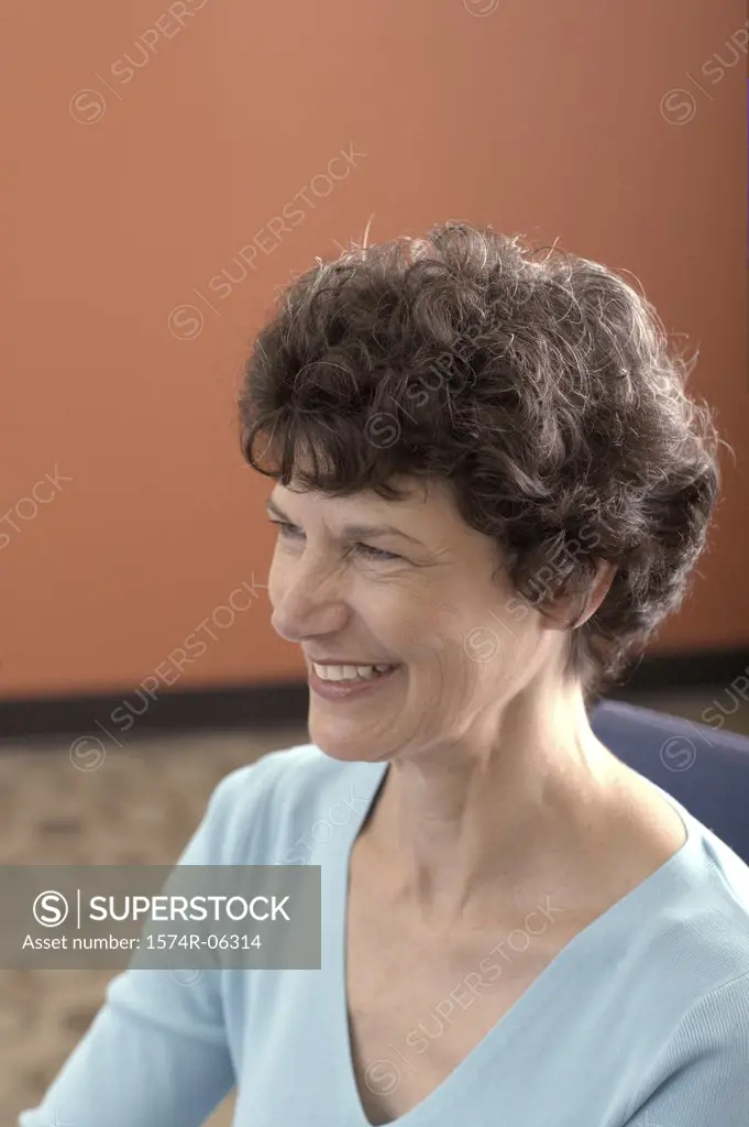 Close-up of a businesswoman smiling in an office