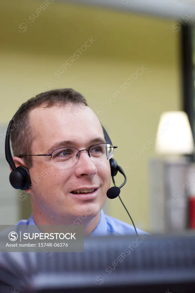 Businessman wearing a headset in an office